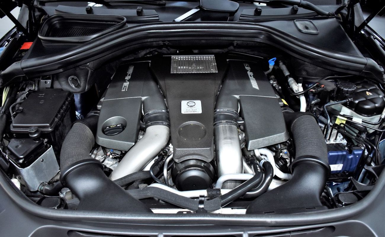 Mercedes-Benz ML 63 AMG EXCELLENT DEAL for our Mercedes Benz ML63 AMG ( 2013 Model ) in Dark Blue Color GCC Specs