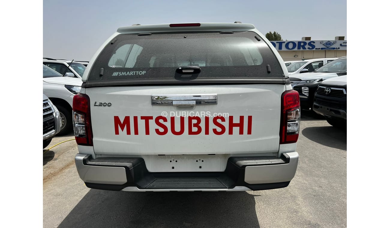 Mitsubishi L200 Euro4 / 2.5L Diesel. M/T Carry Body. Full Option with Black Rims.(CODE # MPL2)