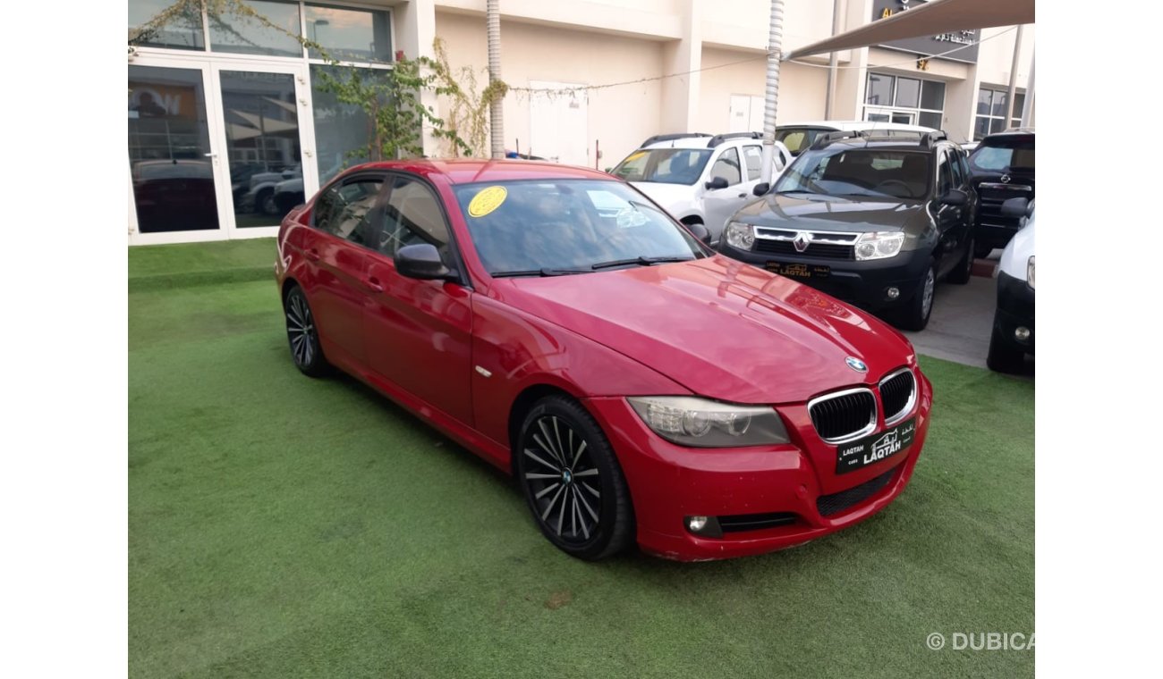 BMW 320i i Gulf Specs Red Color 2009 model in good condition