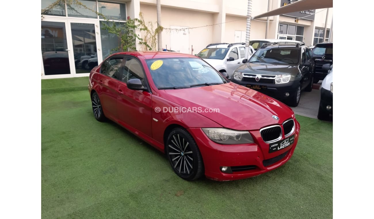 BMW 320i i Gulf Specs Red Color 2009 model in good condition