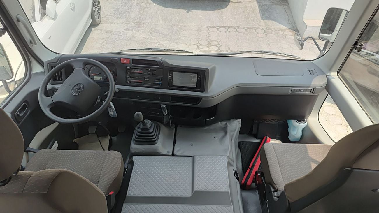 تويوتا كوستر ECTTAE004 - 2025 Toyota Coaster - 4.0L Diesel Manual – 23 Seats, Auto Door, 3PSB, Mic, Baggage Rack 