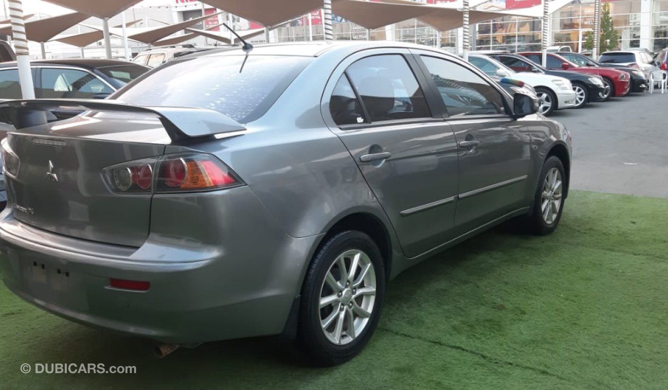 Mitsubishi Lancer Mitsubishi Lancer Gulf 2015 model gray color inside beige without accidents alloy wheels rear wing s