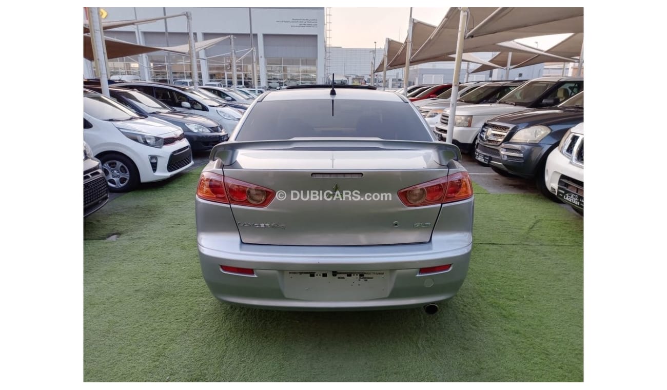 ميتسوبيشي لانسر 1600سى سى موديل 2009 خليجى فل أوبشن  خشب فتحة شاشة كاميرا خلفية بحالة ممتازة