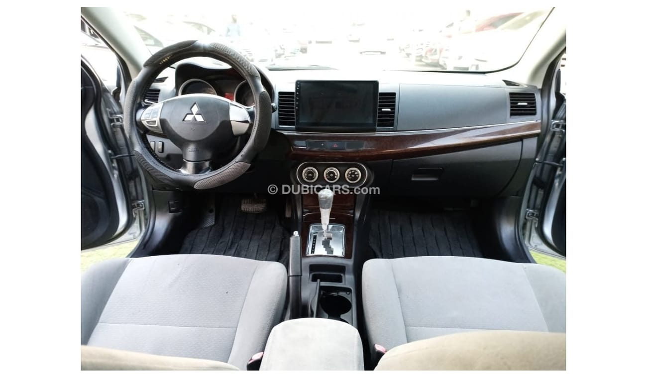 ميتسوبيشي لانسر 1600سى سى موديل 2009 خليجى فل أوبشن  خشب فتحة شاشة كاميرا خلفية بحالة ممتازة