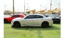 Dodge Charger R/T The Charger RT is powered by a 5.7-liter HEMI V8 engine that produces 370 horsepower and 535 Nm