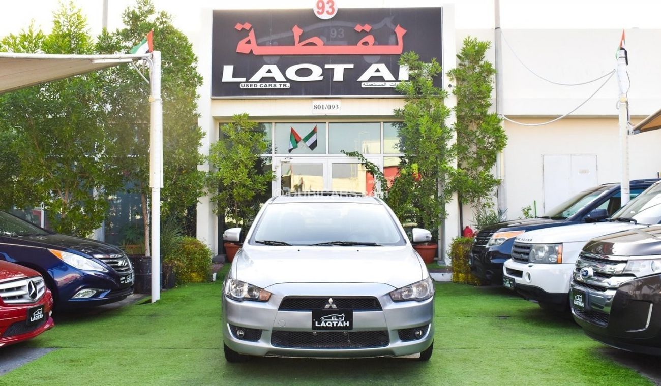 Mitsubishi Lancer 1600 CC, 2016 model, Gulf silver color, rear wing hatch, alloy wheels, FM radio, power conditioning,