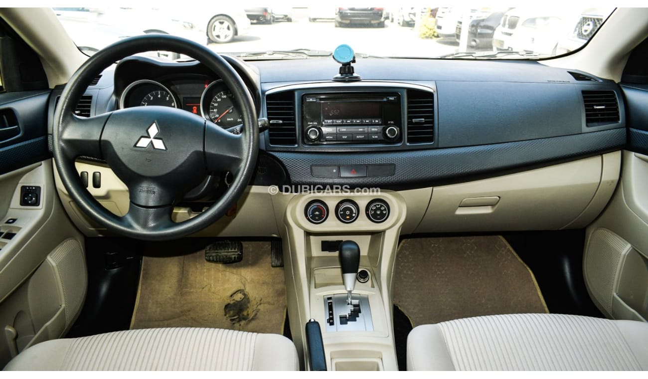 Mitsubishi Lancer Gulf gray color inside beige without accidents Rings rear wing sensors fog lights in excellent condi