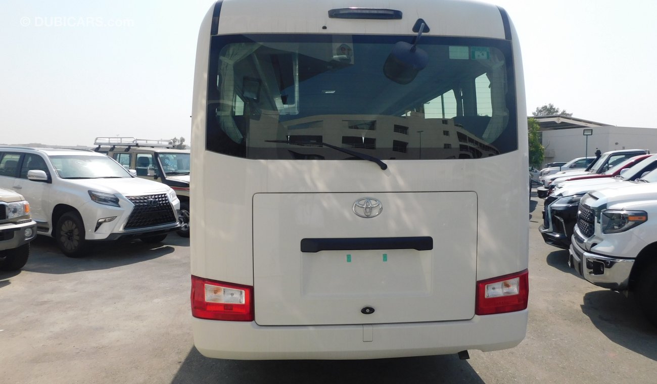 Toyota Coaster 4.2L M/T Diesel 23 passengers - Auto folding door