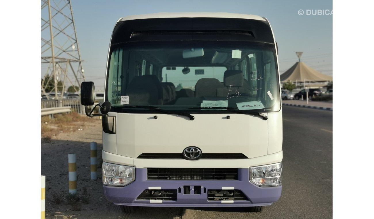 Toyota Coaster 2.7L PETROL, 17.5" TYRE, FABRIC SEATS, XENON HEADLIGHTS (CODE # TC01)