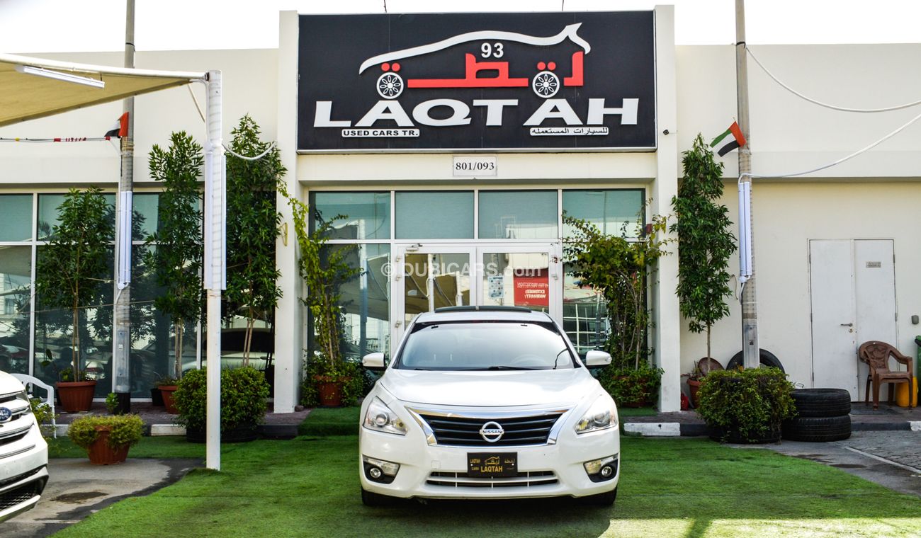 Nissan Altima White color inside Big Ward No.1 fingerprint slot, leather alloy wheels, camera screen control senso