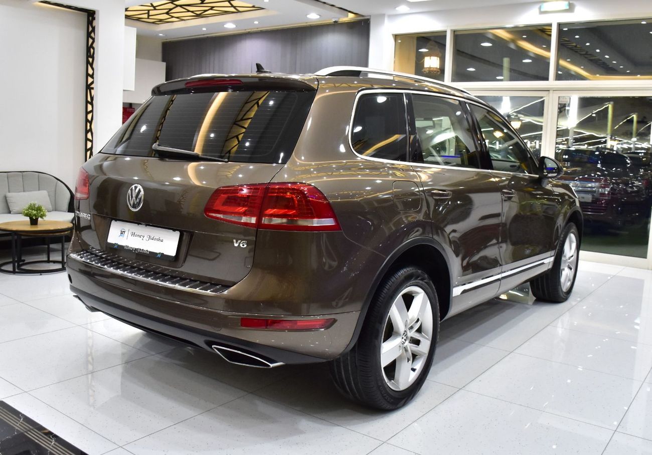 Volkswagen Touareg SEL EXCELLENT DEAL for our Volkswagen Touareg ( 2015 Model ) in Brown Color GCC Specs