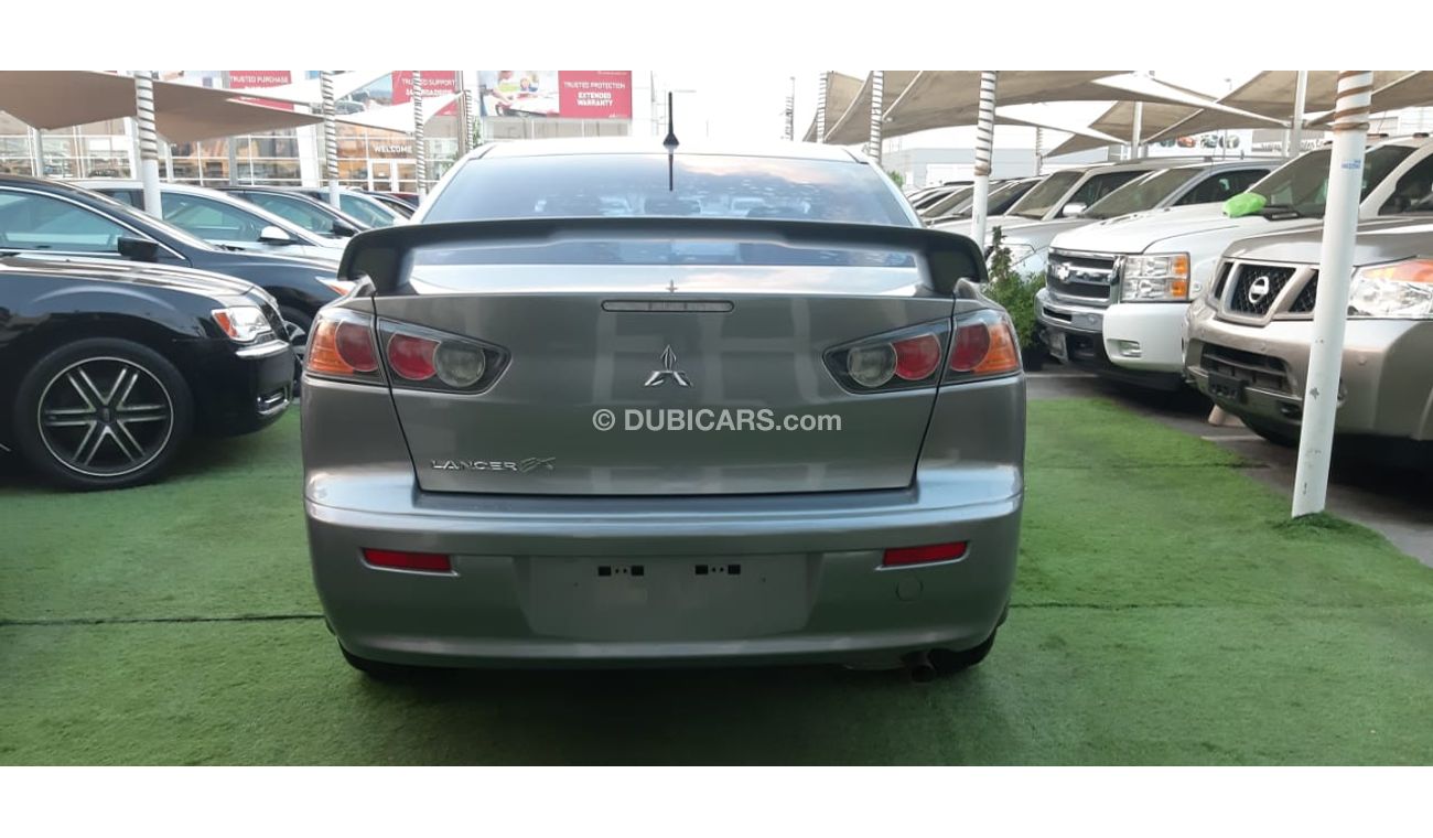 Mitsubishi Lancer Gulf gray color inside beige without accidents Rings rear wing sensors fog lights in excellent condi