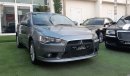 Mitsubishi Lancer Gulf gray color inside beige without accidents Rings rear wing sensors fog lights in excellent condi