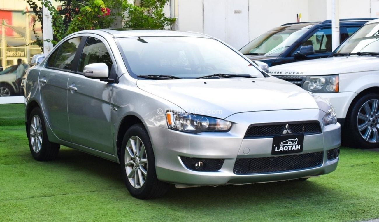 Mitsubishi Lancer 1600 CC, 2016 model, Gulf silver color, rear wing hatch, alloy wheels, FM radio, power conditioning,