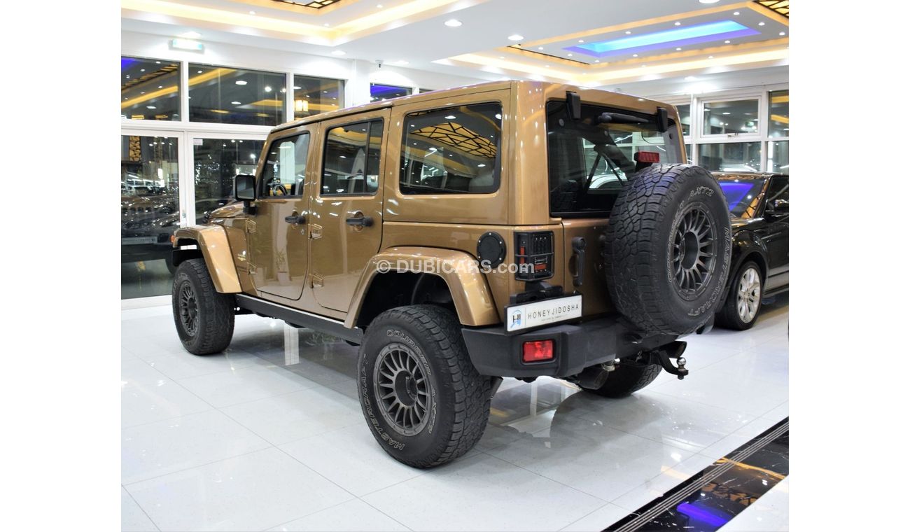 Jeep Wrangler Sahara EXCELLENT DEAL for our Jeep Wrangler UNLIMITED SAHARA 4x4 ( 2015 Model! ) in Brown Color! GCC