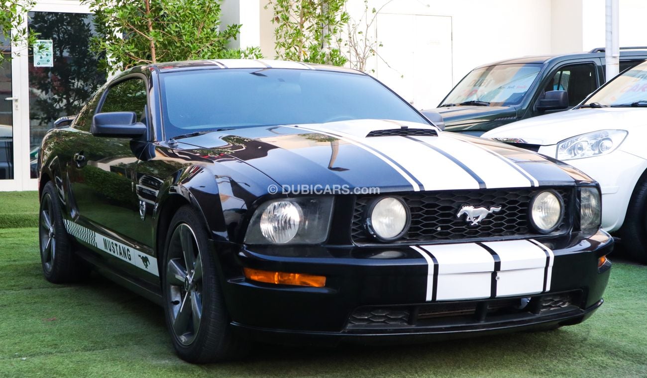 فورد موستانج خليجى كوبيه موديل 2009 لون أسود بحالة ممتازة لاتحتاج لأى مصاريف