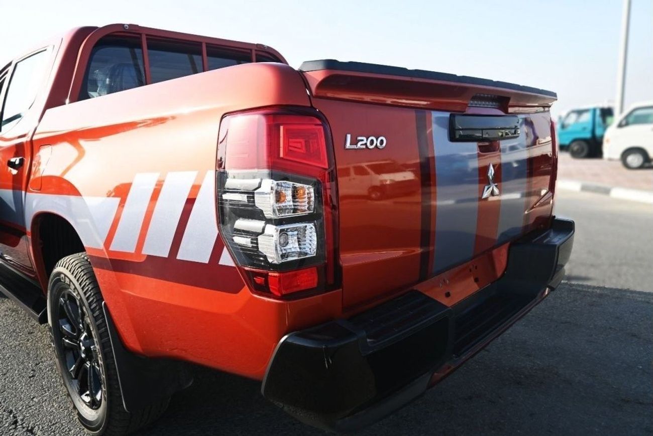 ميتسوبيشي L200 ميتسوبيشي L200 ديزل فل أوبتيون أوتوماتيك 2.4 لتر برتقالي من الخارج أسود من الداخل