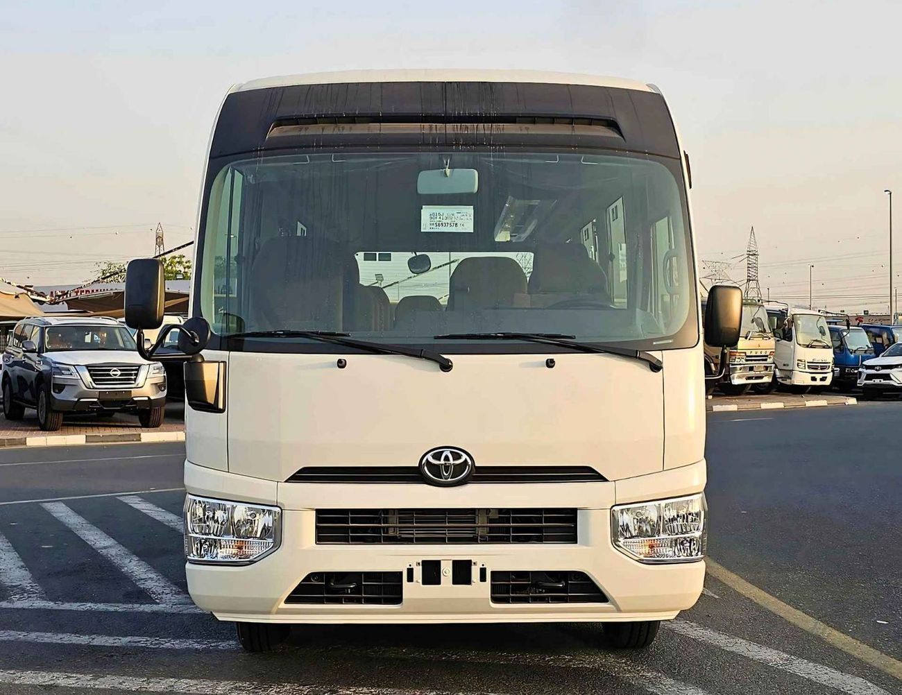 تويوتا كوستر 4.0L V4 DIESEL / 23 STR M/T / AUTO DOOR / BAGGAGE TRAY WITH RACK (CODE # COD4J)