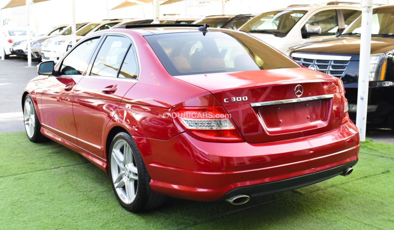 Mercedes-Benz C 300 2009 model, red color, number one, panorama, leather, cruise control, sensor wheels, in excellent co