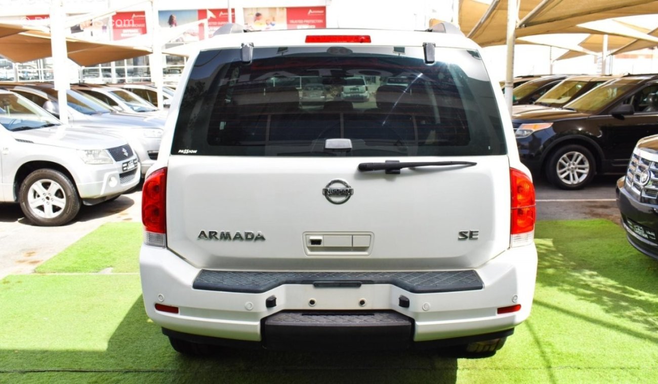 Nissan Armada SE, 2011 GCC model, white, beige interior, number one, cruise control, alloy wheels, in excellent co