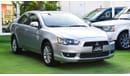 Mitsubishi Lancer 1600 CC, 2016 model, Gulf silver color, rear wing hatch, alloy wheels, FM radio, power conditioning,