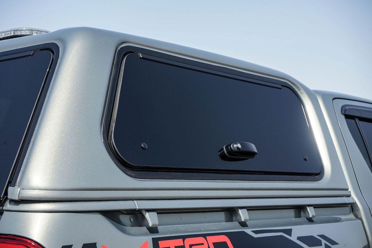 Toyota Hilux A Hilux canopy is a protective shell with a roof, walls, and windows that fits over the tray of a To