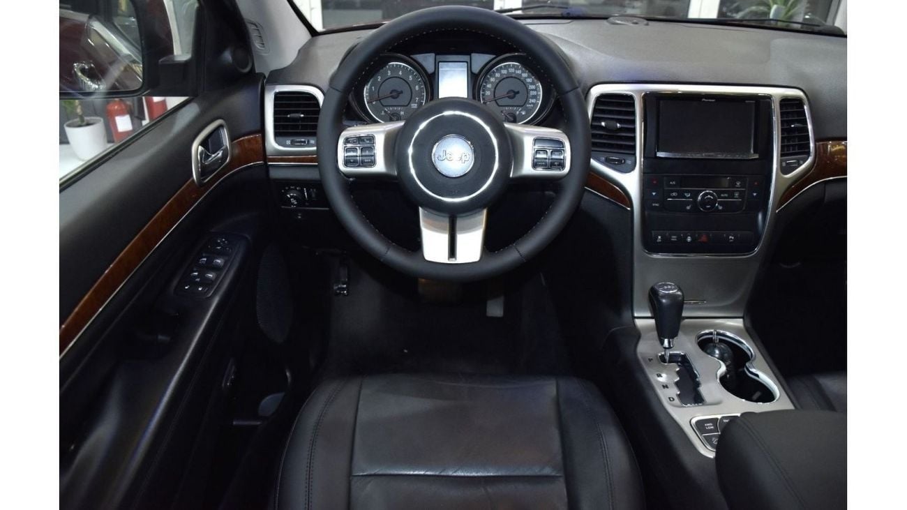 Jeep Grand Cherokee EXCELLENT DEAL for our Jeep Grand Cherokee Limited 4x4 ( 2013 Model ) in Red Color GCC Specs