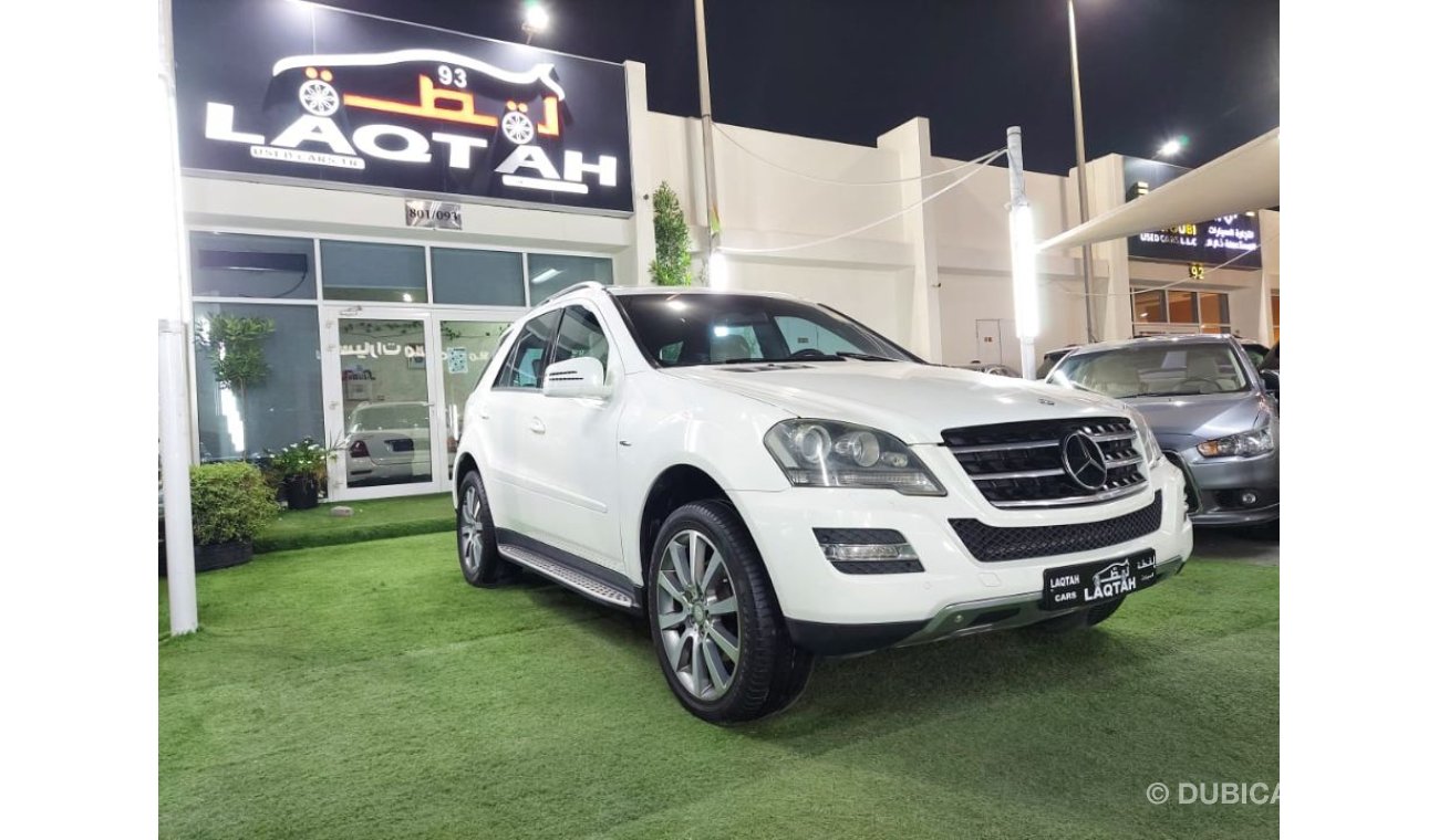 مرسيدس بنز ML 350 خليجي موديل 2011 لون ابيض داخل بيج رقم واحد فتحه جلد رنجات حساسات شاشه كاميرا بحاله ممتازه