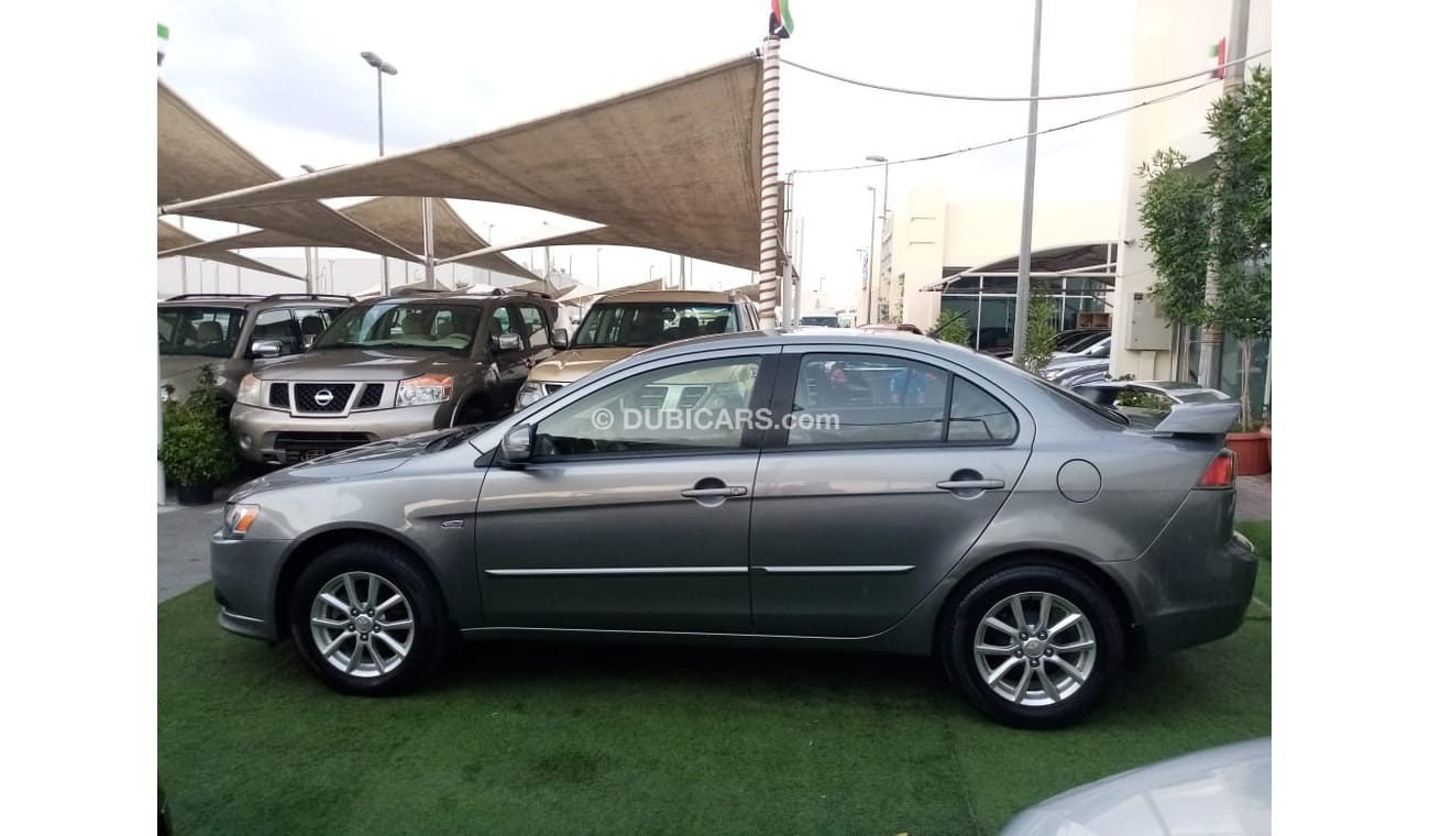 Mitsubishi Lancer Gulf gray color, inside beige without accidents, rear wing sensors, fog lights, in excellent conditi