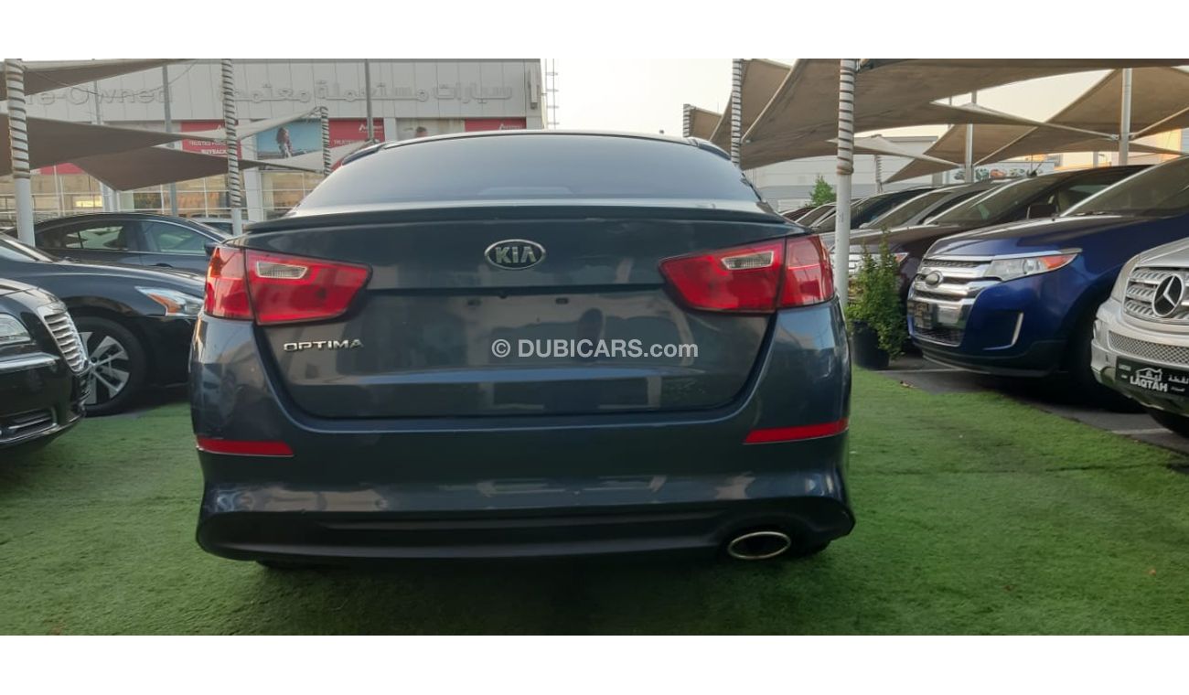 كيا أوبتيما خليجى رقم 2  شاشة   كاميرا  مثبت  سرعة  جناح خلفى رنجات حساسات أنوار ضباب بحالة ممتازة