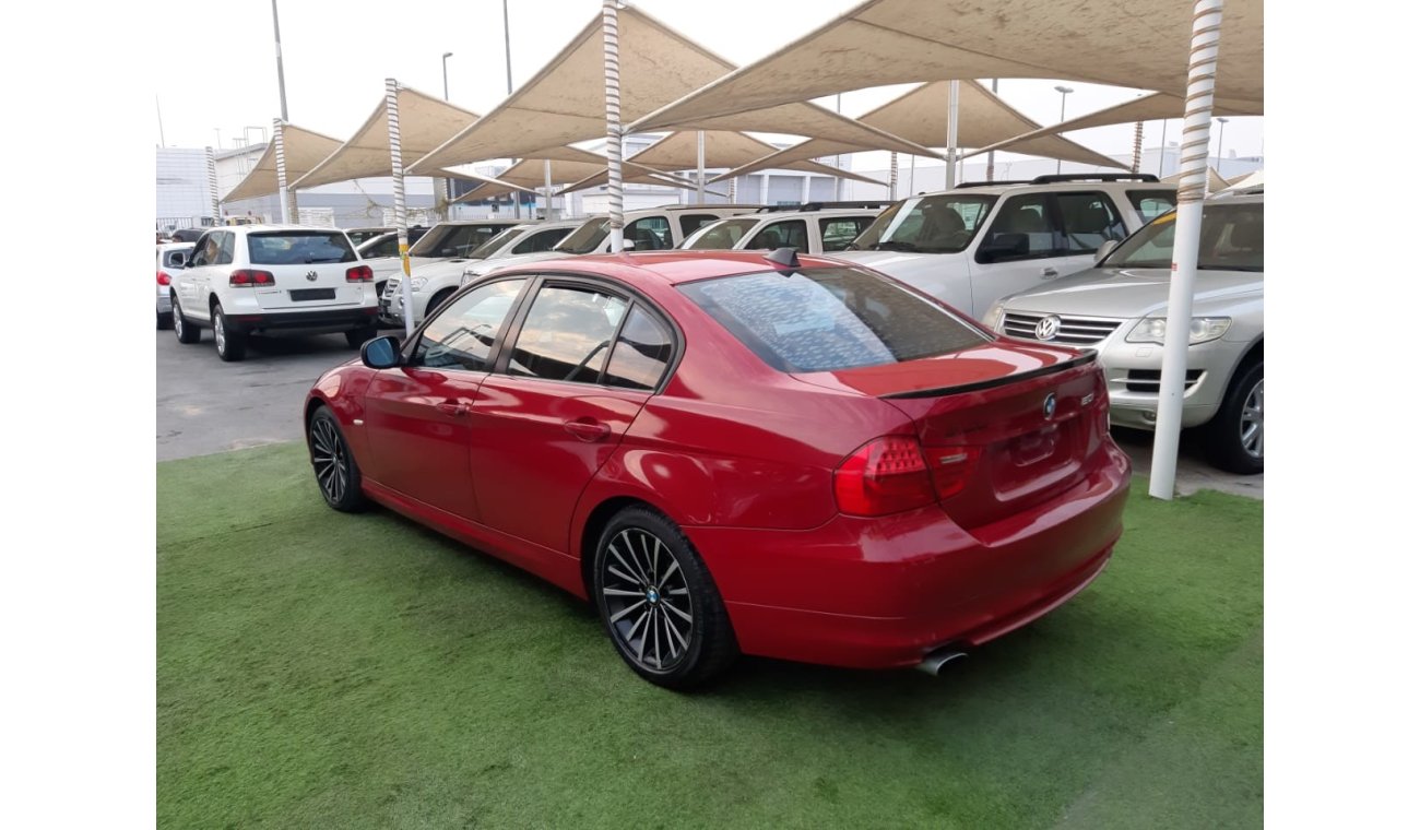 BMW 320i i Gulf Specs Red Color 2009 model in good condition