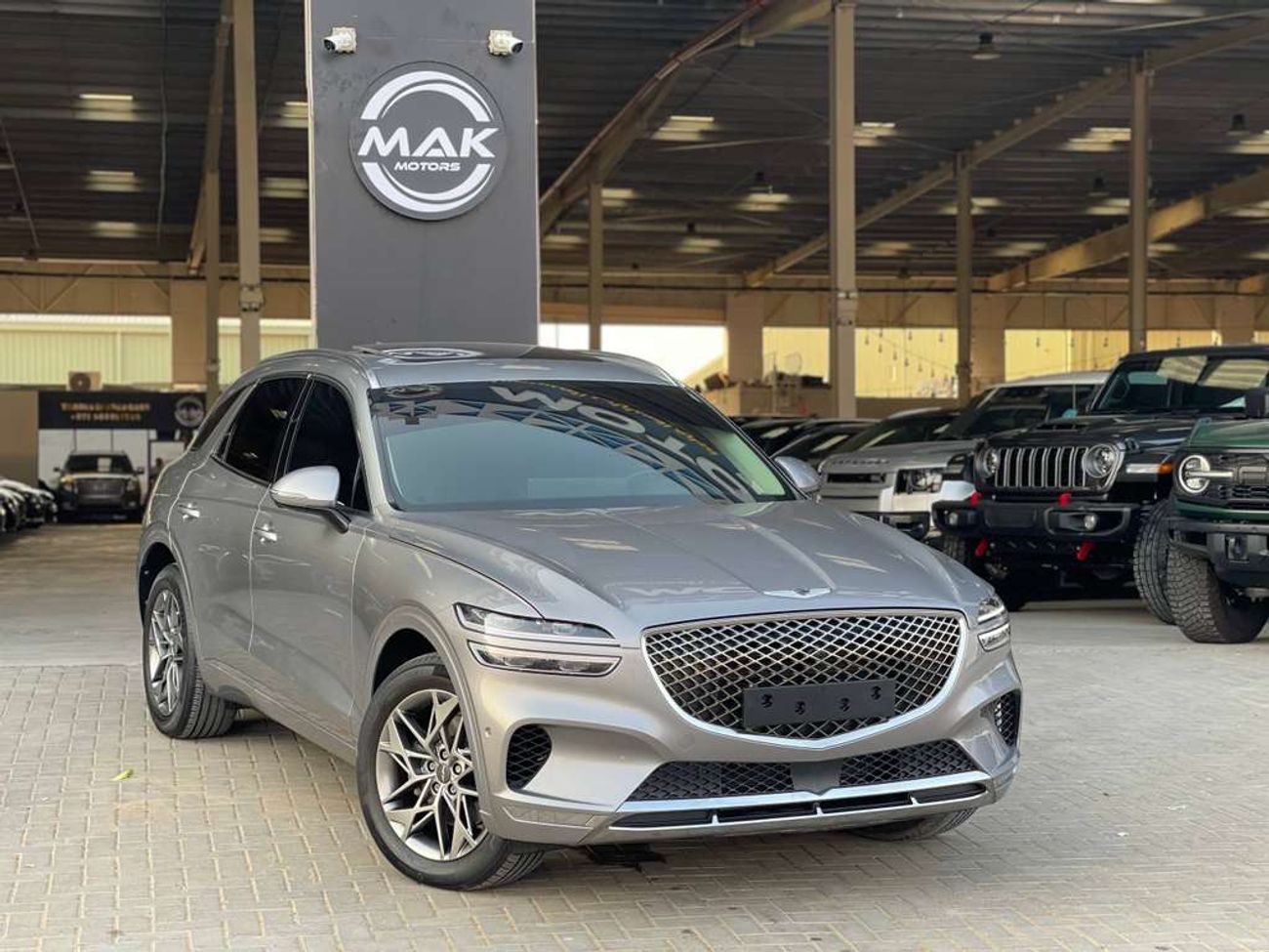 جينيسس GV70 / دفع رباعي / فتحة سقف بانورامية / كاميرا 360 درجة / مسافة منخفضة / بحالة ممتازة