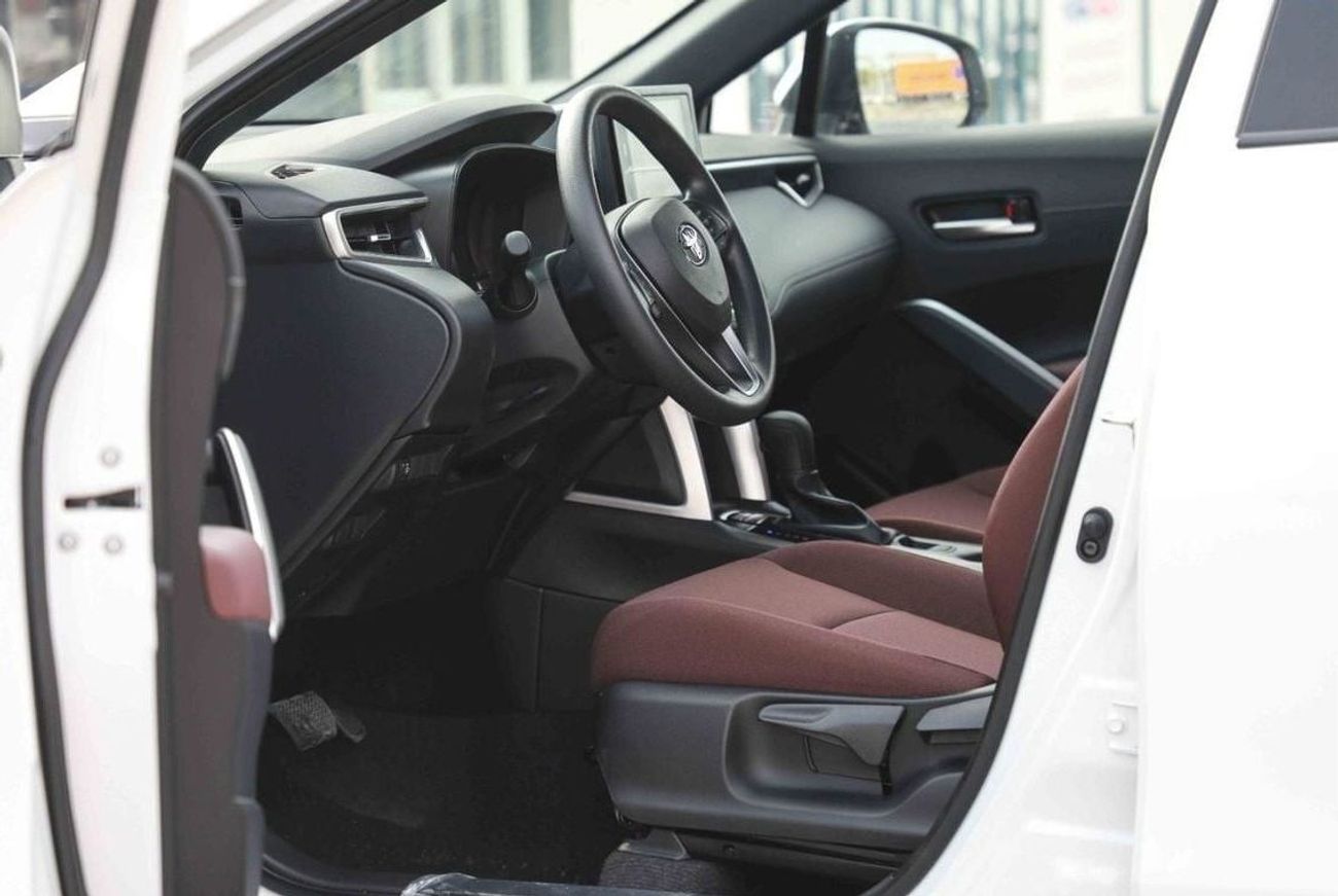 تويوتا كورولا كروس 2025 TOYOTA COROLLA CROSS MID 1.8 Hybrid - PLATINUM WHITE PEARL inside RED | Export Only