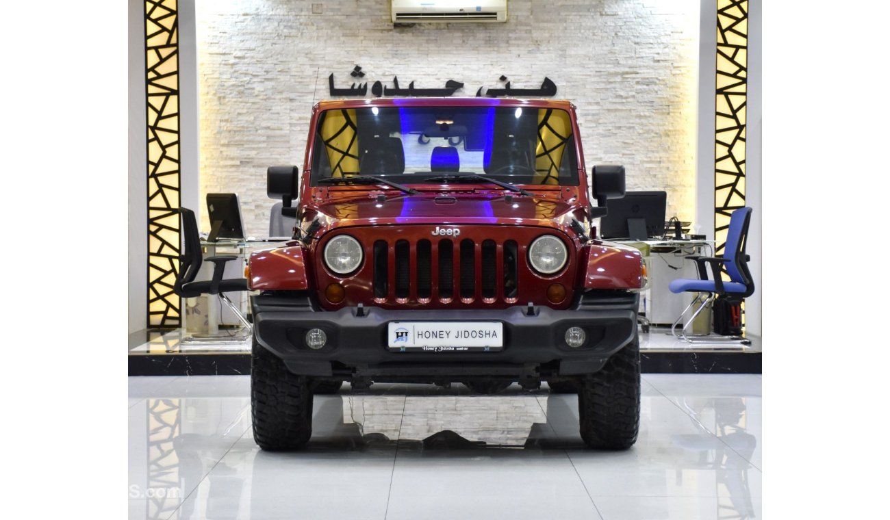 Jeep Wrangler EXCELLENT DEAL for our Jeep Wrangler Unlimited SAHARA ( 2012 Model ) in Maroon Color GCC Specs