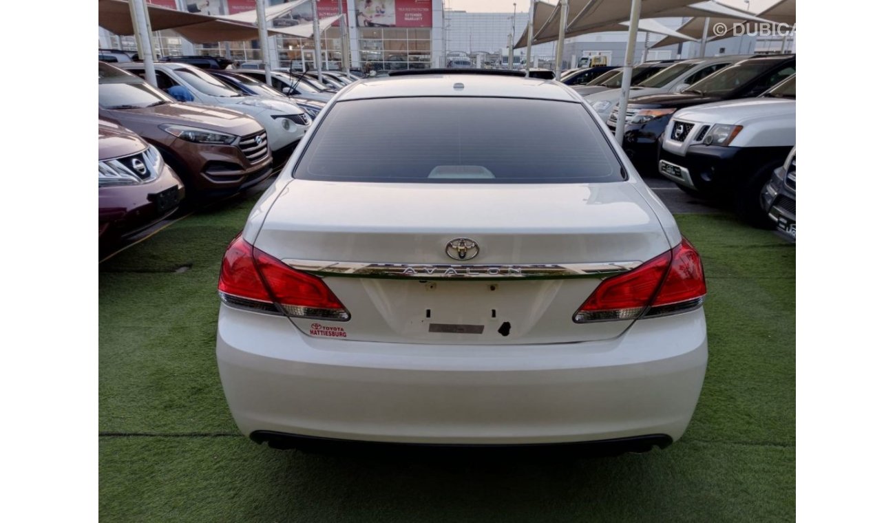 Toyota Avalon 2011 model, leather hatch, cruise control, sensor wheels, in excellent condition