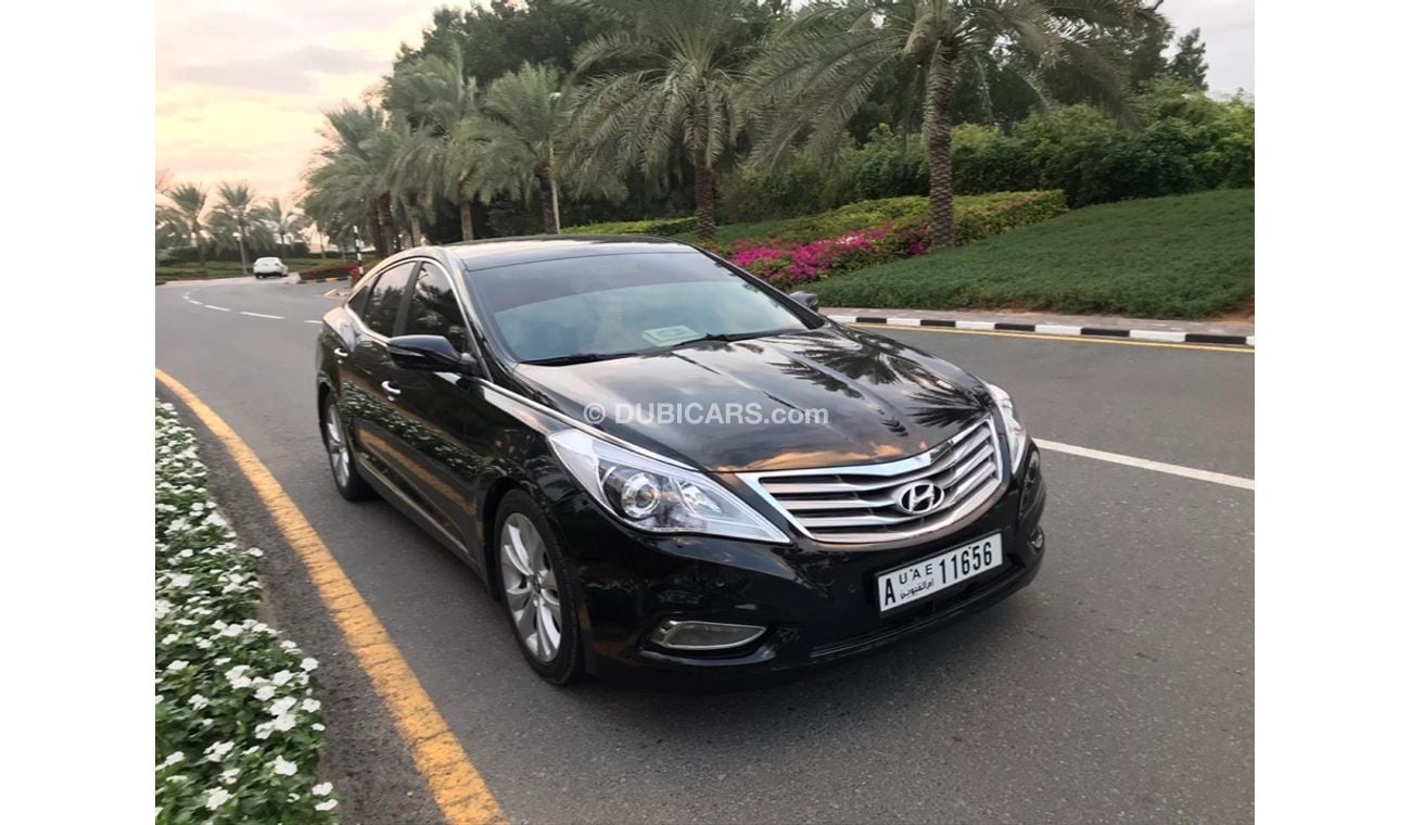 هيونداي أزيرا هيونداي ازيرا موديل 2013 خليجي صبغه وكاله فل اوبشن  بانوراما مثبت سرعه زكي كراسي جلد تبريد وتسخين