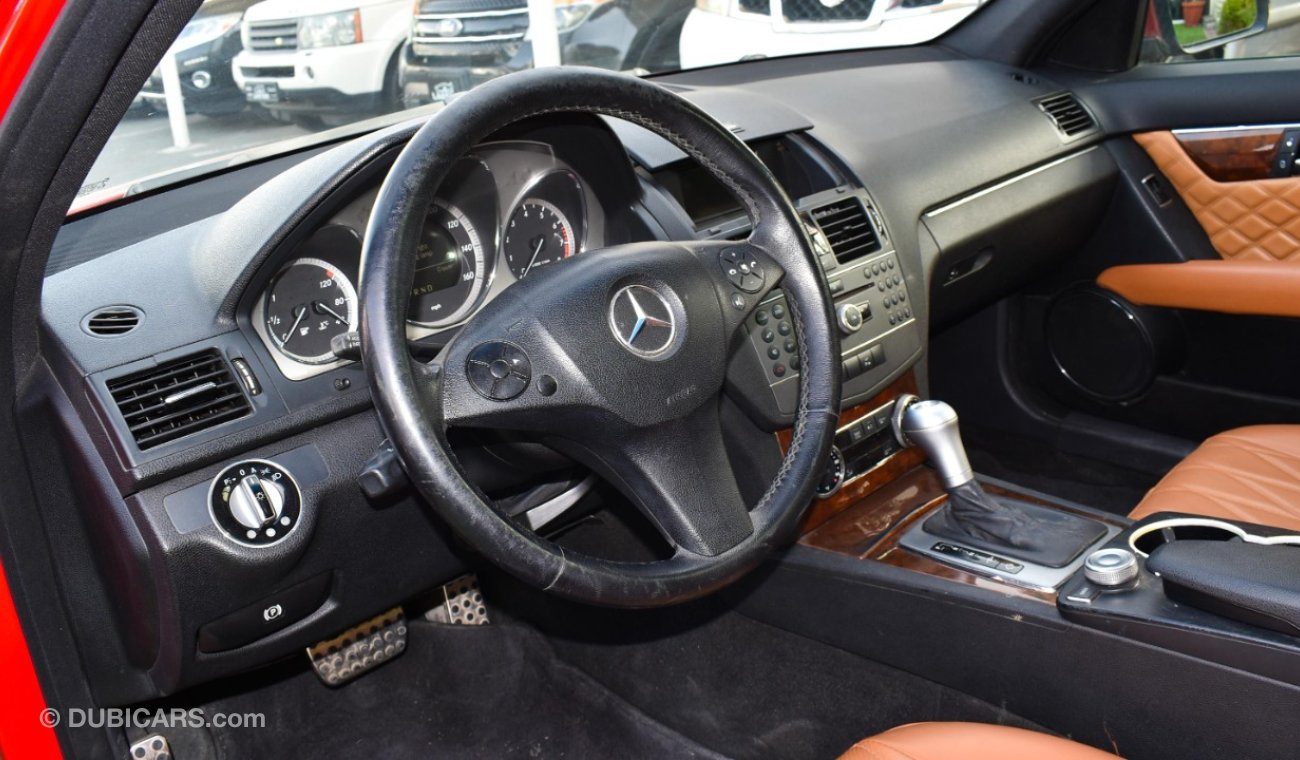 Mercedes-Benz C 300 2009 model, red color, number one, panorama, leather, cruise control, sensor wheels, in excellent co