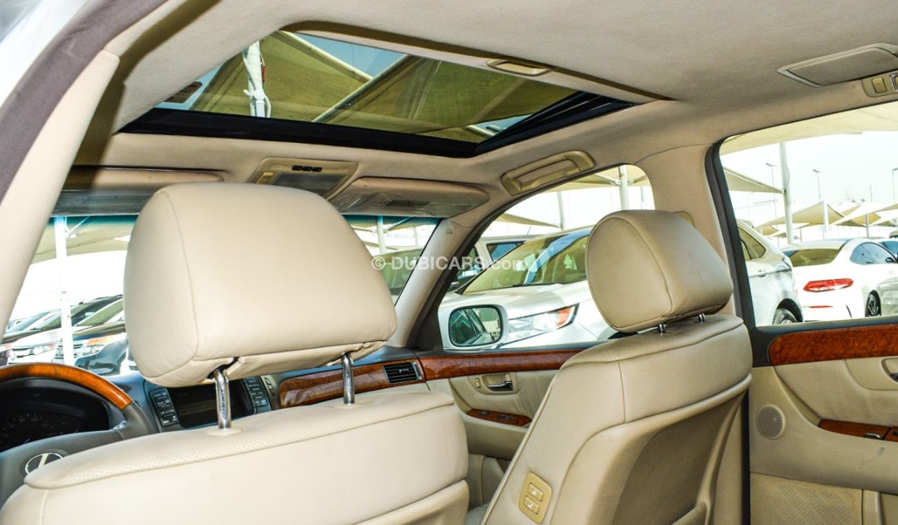 Lexus LS430 Imported 1/2 Ultra 2006 model, white color, leather opening, wooden wheels, electric mirrors, electr