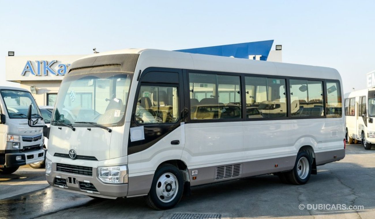 Toyota Coaster 4.2L V6 M/T Diesel 23 passengers - 16″ wheels - brown interior