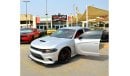 Dodge Charger R/T The Charger RT is powered by a 5.7-liter HEMI V8 engine that produces 370 horsepower and 535 Nm