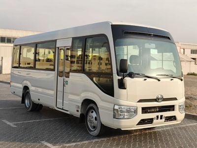 تويوتا كوستر 2025 Toyota Coaster High-Roof 23-Seater (2-Point Seatbelts) 4.0L 4-Cyl Turbo Diesel M/T RWD Export O