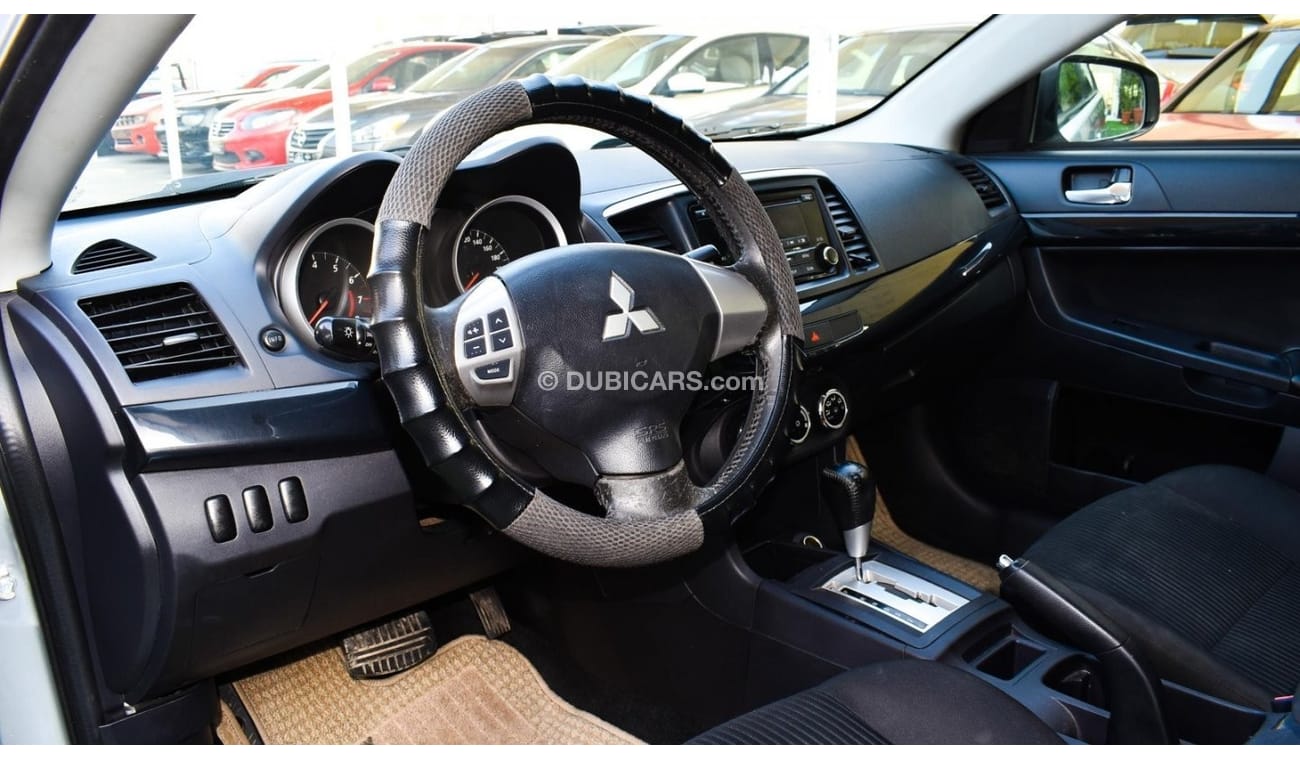 Mitsubishi Lancer 1600 CC, 2016 model, Gulf silver color, rear wing hatch, alloy wheels, FM radio, power conditioning,