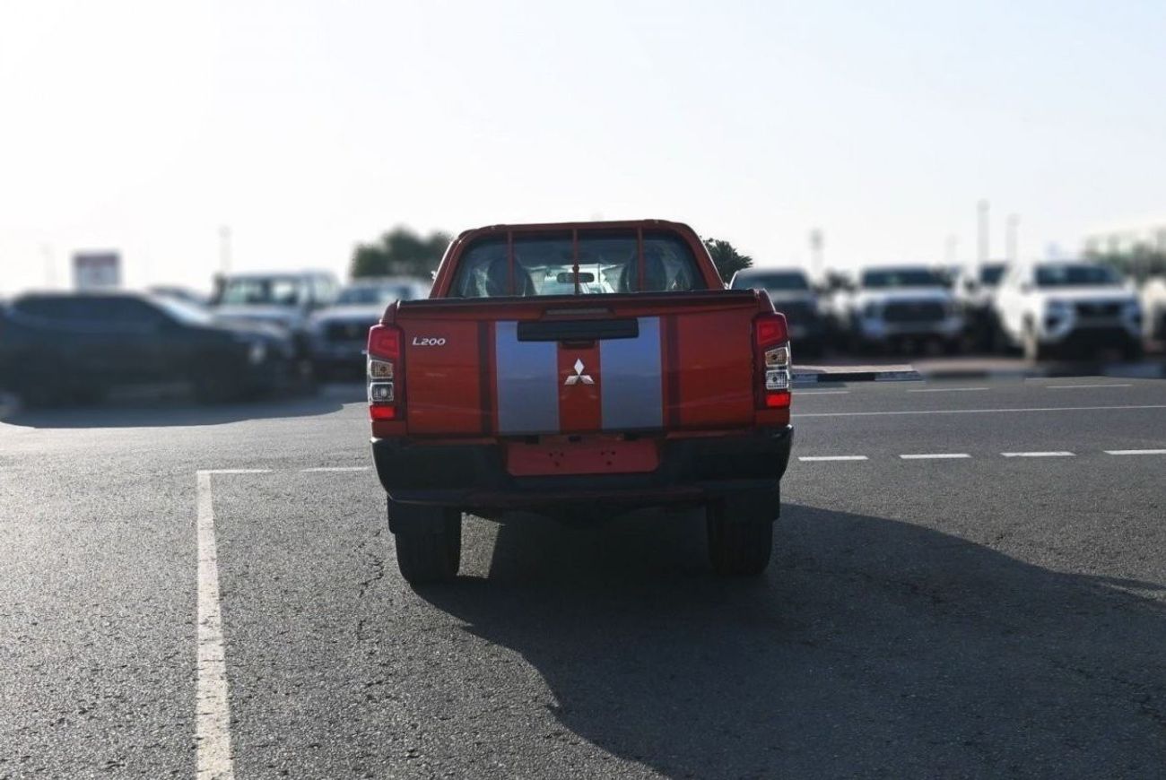 ميتسوبيشي L200 ميتسوبيشي L200 ديزل فل أوبتيون أوتوماتيك 2.4 لتر برتقالي من الخارج أسود من الداخل