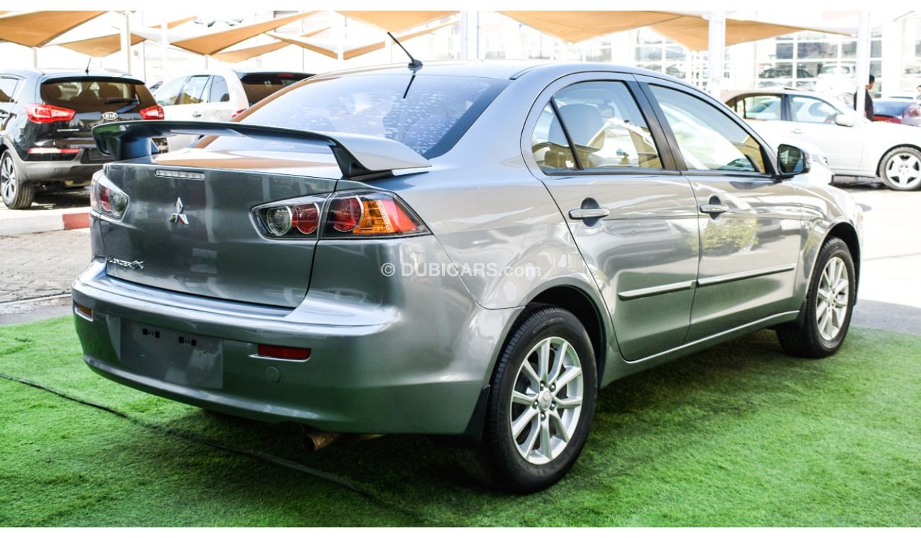 Mitsubishi Lancer Gulf gray color inside beige without accidents Rings rear wing sensors fog lights in excellent condi