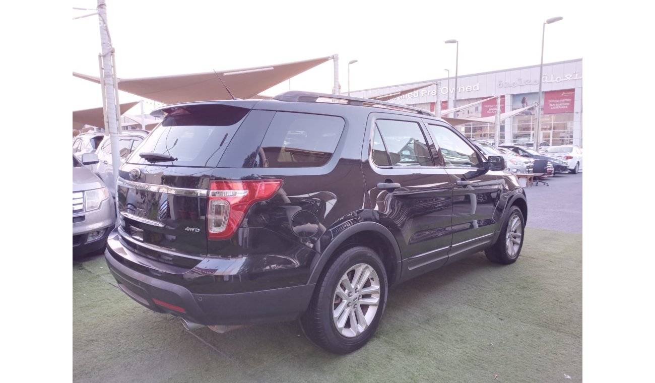 Ford Explorer 2014 model, painted, Gulf agency, cruise control, sensors, wheels, fog lights, wood, rear wing, in e