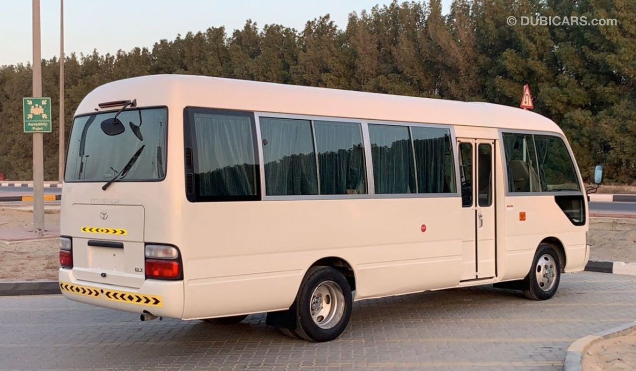 تويوتا كوستر 2015 Petrol 30 Seats High Roof Ref#705