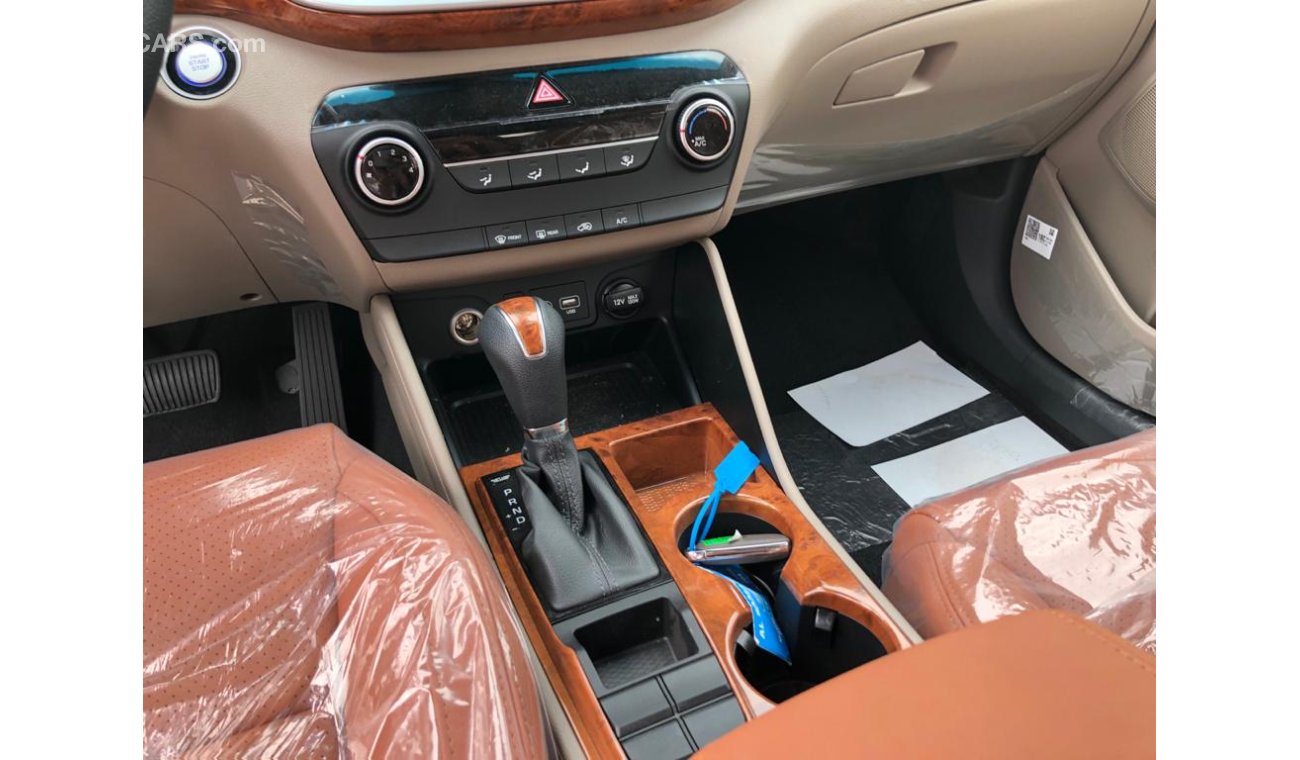هيونداي توسون 2.0L, 2 Power Seats, Push Start, Alloy Rims 17', DVD+Rear Camera+Leather Seats+Wooden Interior+GRILL