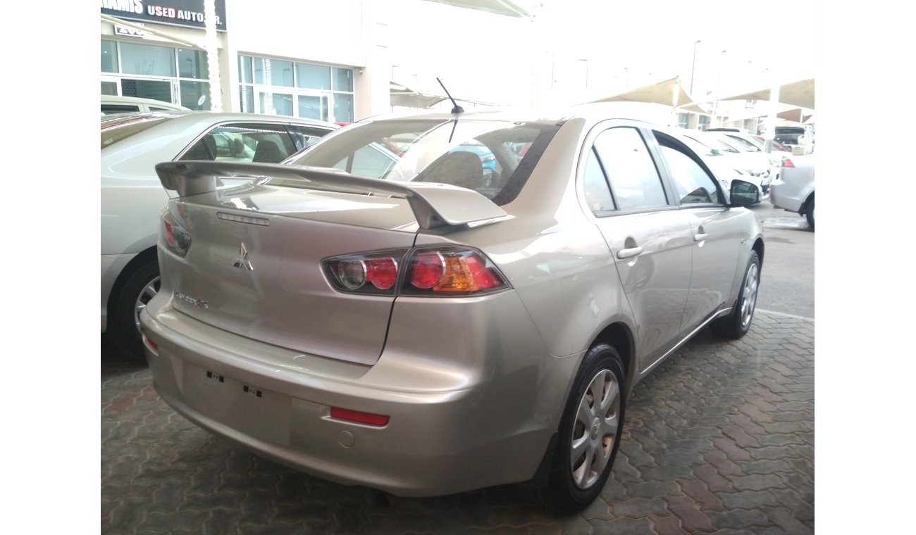 Mitsubishi Lancer SILVER 2015 GCC  NO PAIN NO ACCIDENT PERFECT