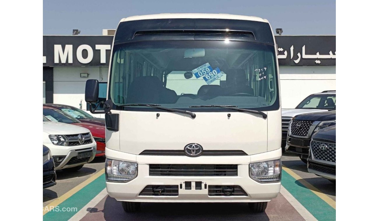 تويوتا كوستر 4.2L V6 DIESEL / 23 STR M/T / AUTO DOOR /  LUGGAGE RACKS (CODE # CD42B)