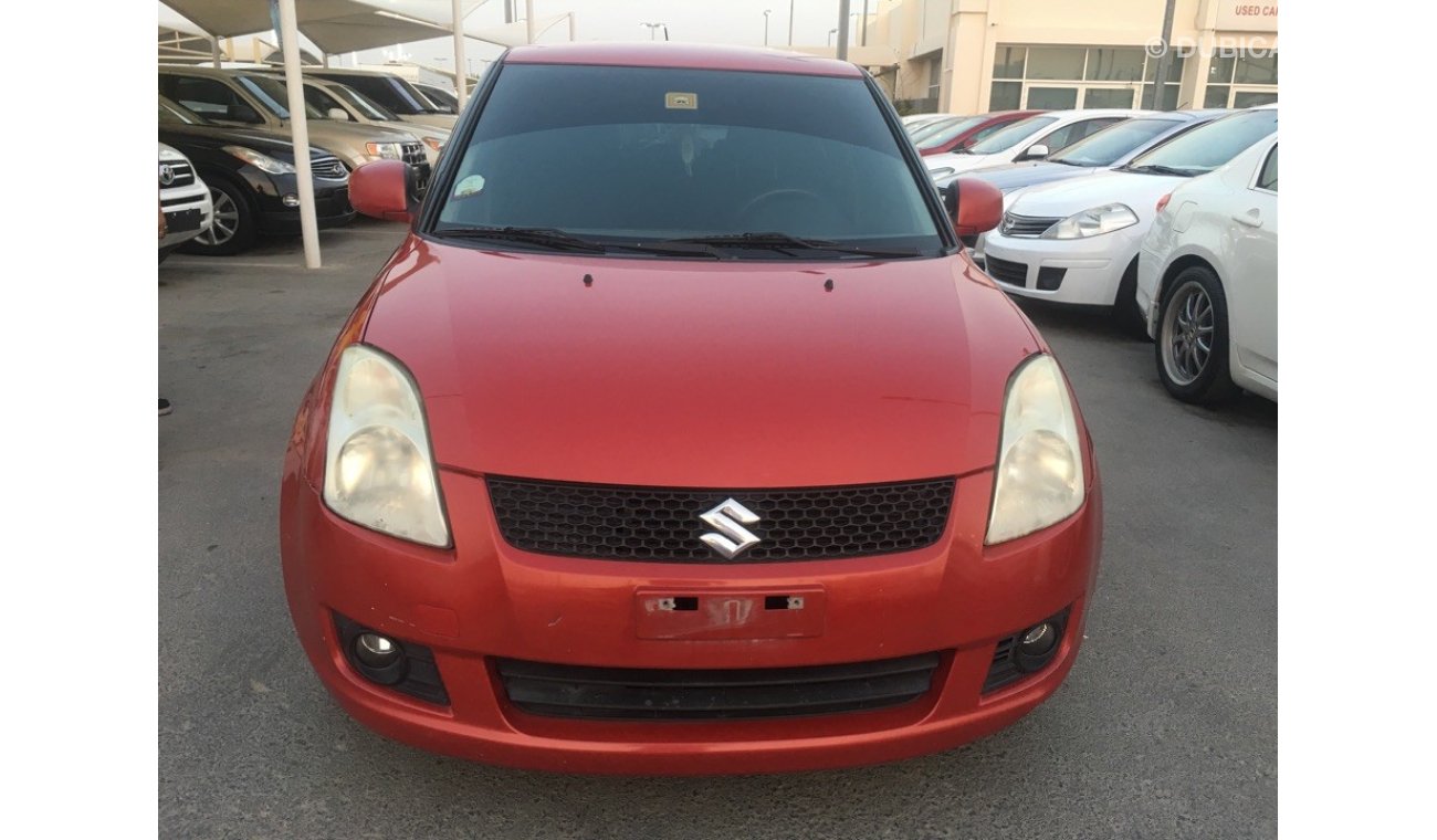 Suzuki Swift clean from the agency's first owner 2009 red color